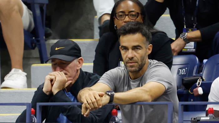 Brad Gilbert (L), coach for Coco Gauff reacts during U.S. Open.